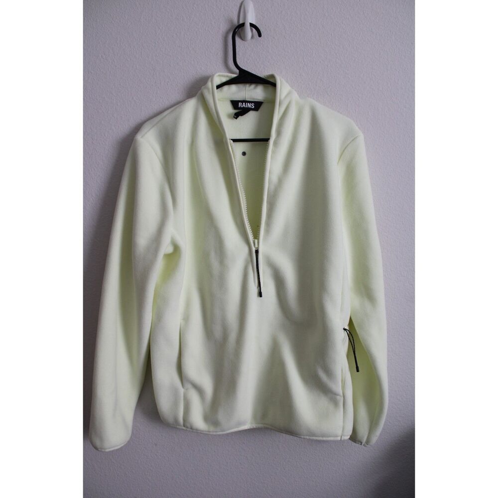 Rains Fleece Pullover in a light yellow size xsmall excellent condition